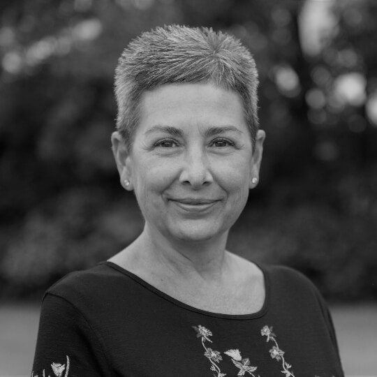 Black and White Headshot of Agent & Office Manager, Nancy Biddinger